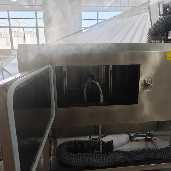 Steam shrink tunnel and sleeve labeling station on packaging line - Tranfull