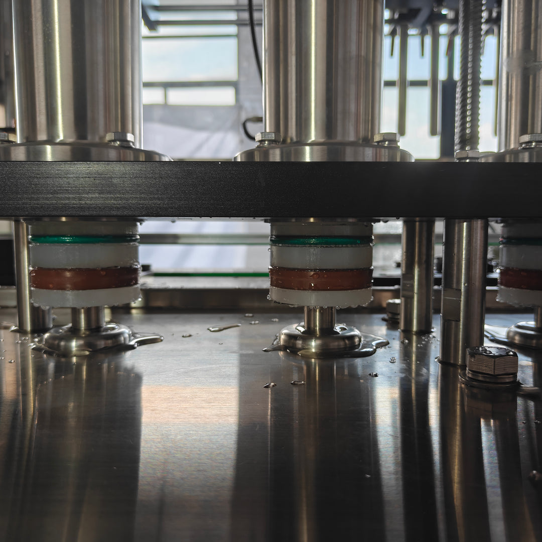 Servo Piston Liquid Filling Machine Production Line Side View - Tranfull