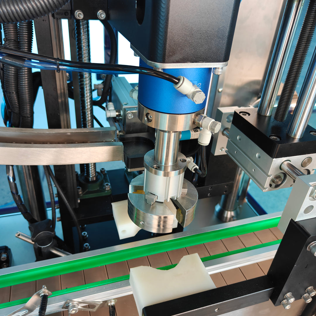 Capping head detail of servo capping machine - Tranfull